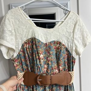 Large, floral, knee length dress with belt.